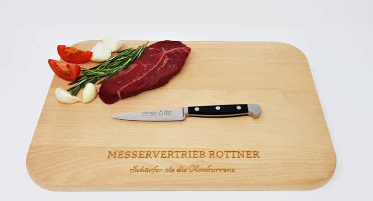 Güde Alpha paring knife front view on cutting board